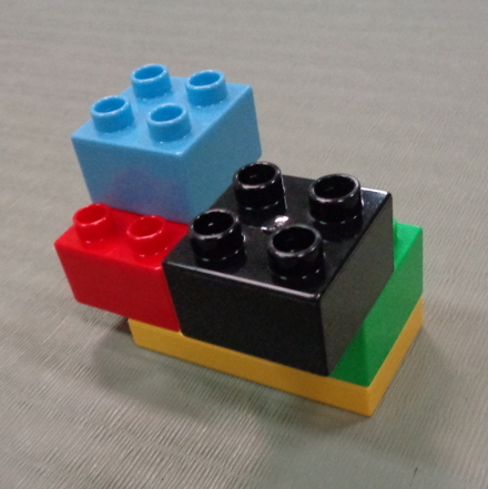 some lego blocks fitting together some lego blocks fitting together