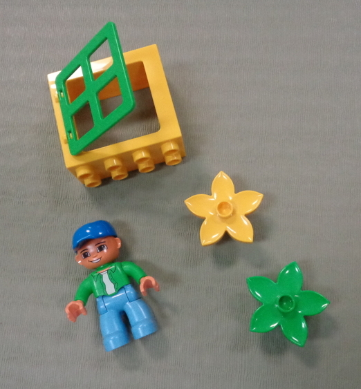 unusual lego blocks - a person, flowers, a window unusual lego blocks - a person, flowers, a window