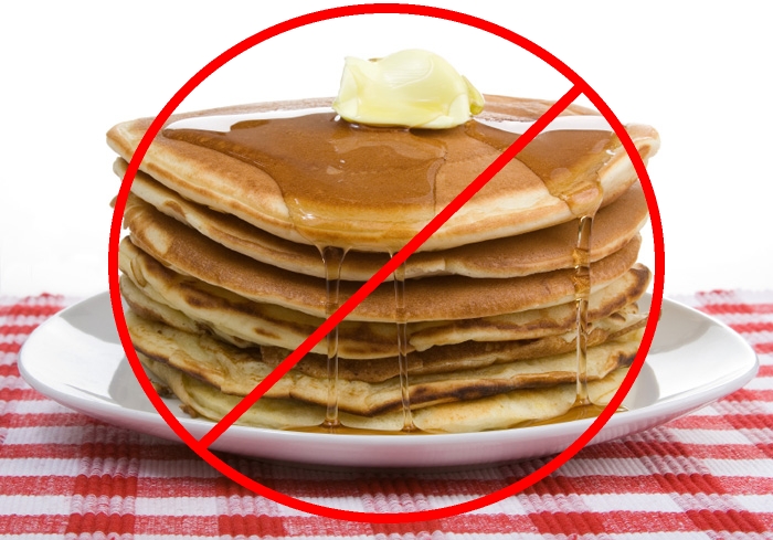 a stack of pancakes with a slash through them
